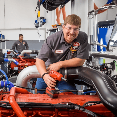 Technician working on engine